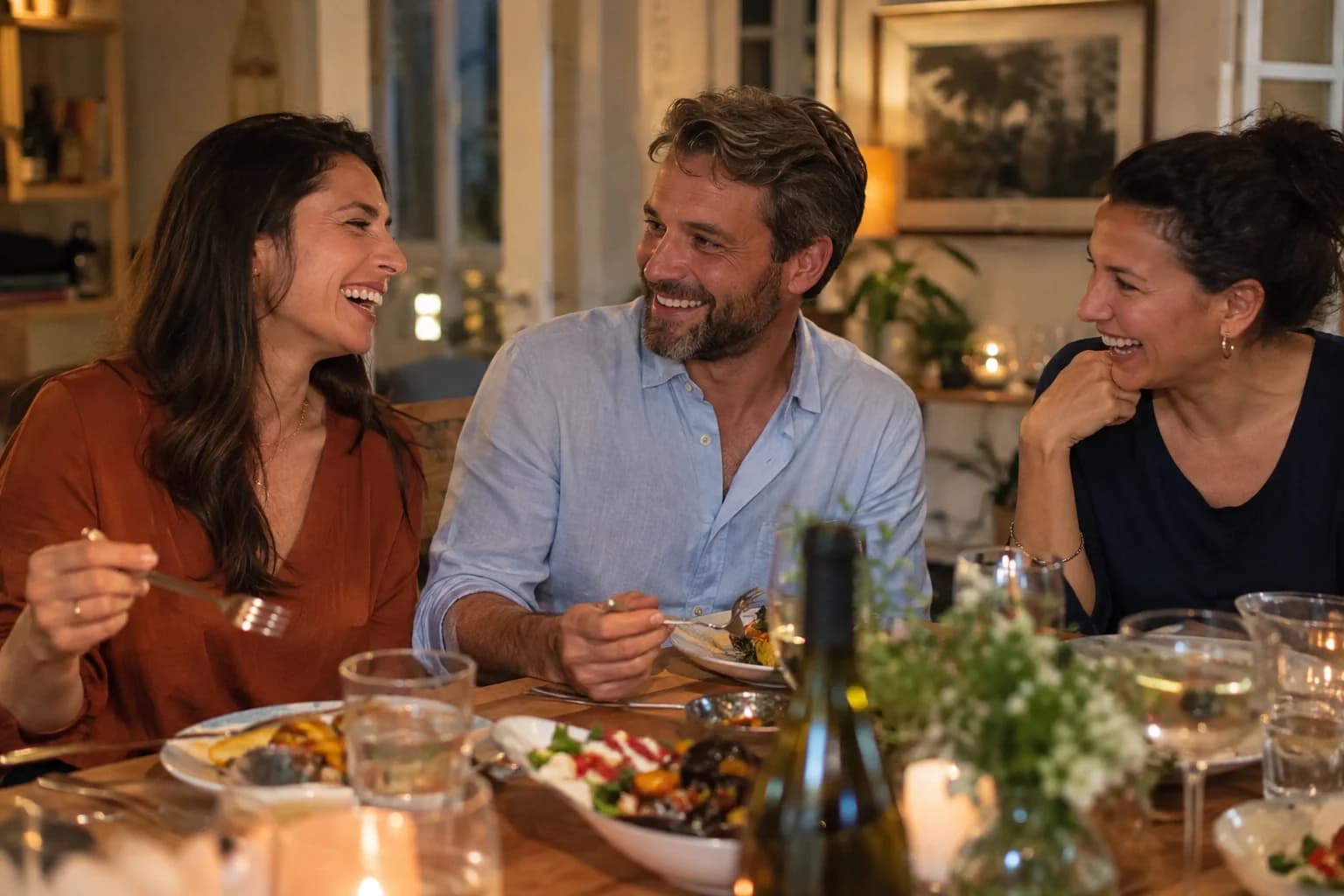Friends sharing a laugh over dinner